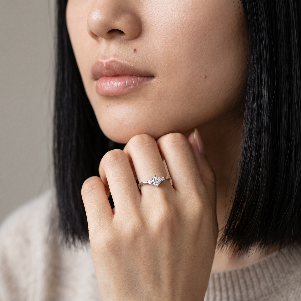 Vittoria Ring worn on the ring finger, close-up portrait