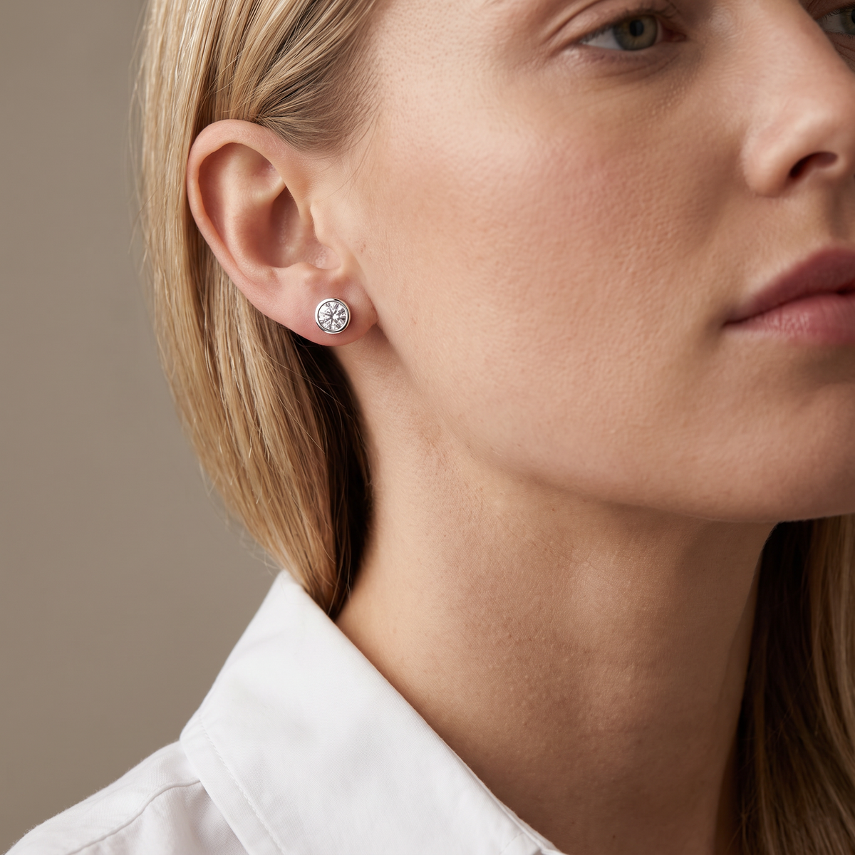 Aura Earrings worn, close-up portrait