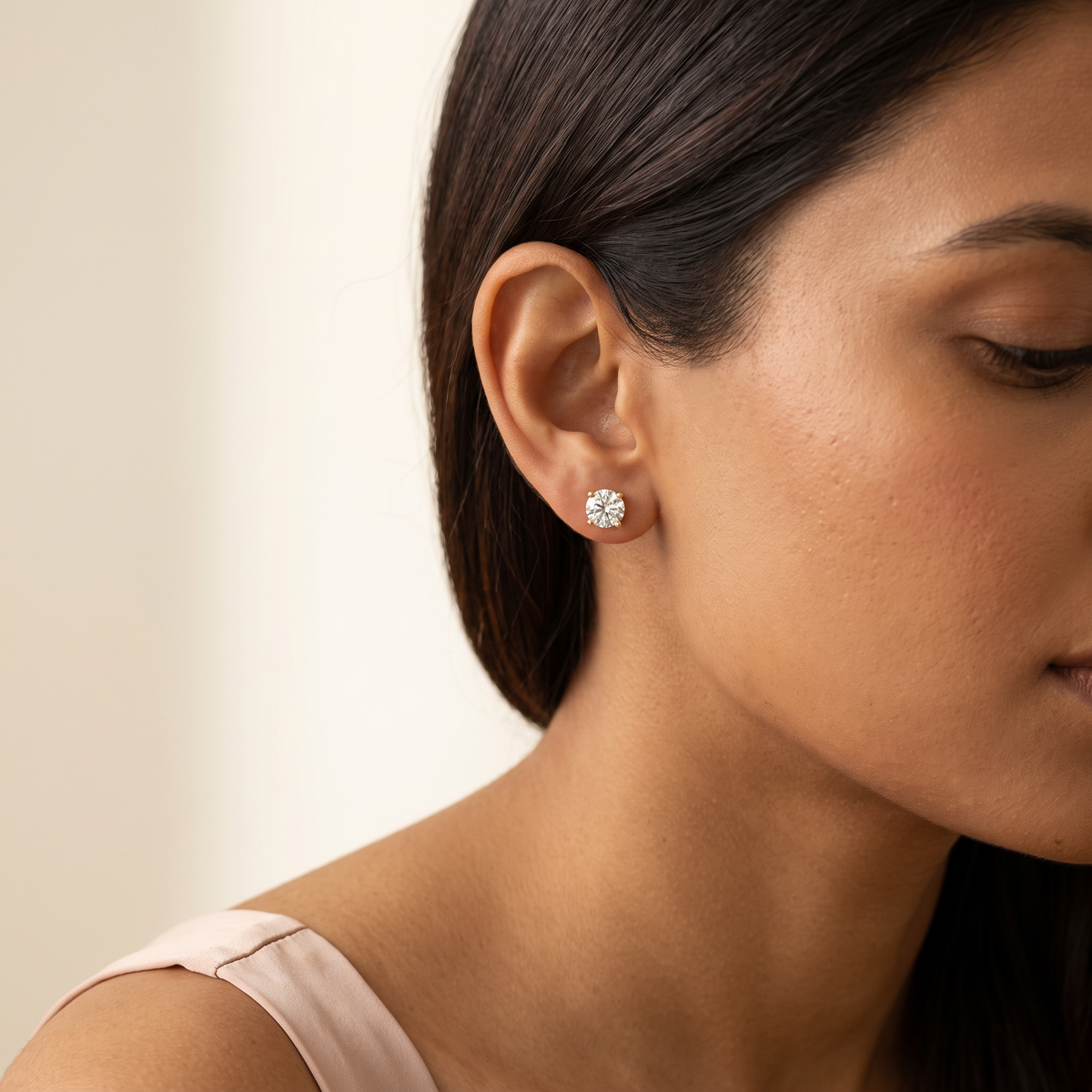 Prima Stud Earrings in gold worn, close-up portrait