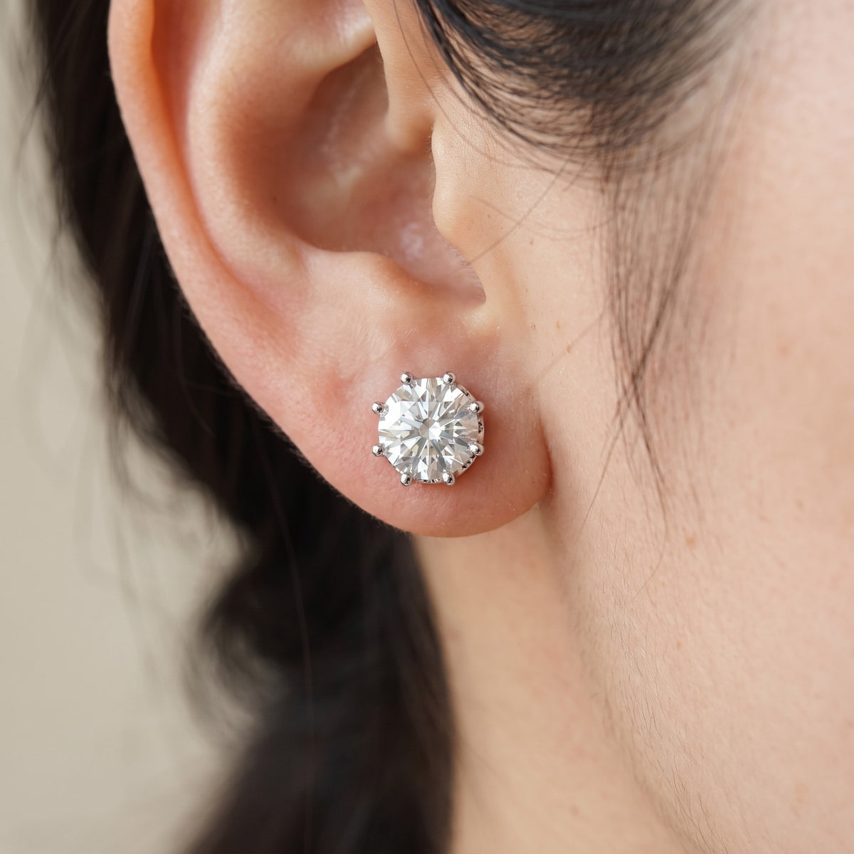 Corona Stud Earrings worn on ear