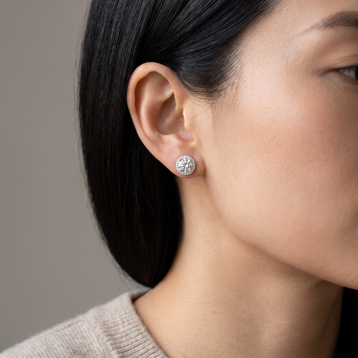 Sole Halo Stud Earrings worn, close-up portrait