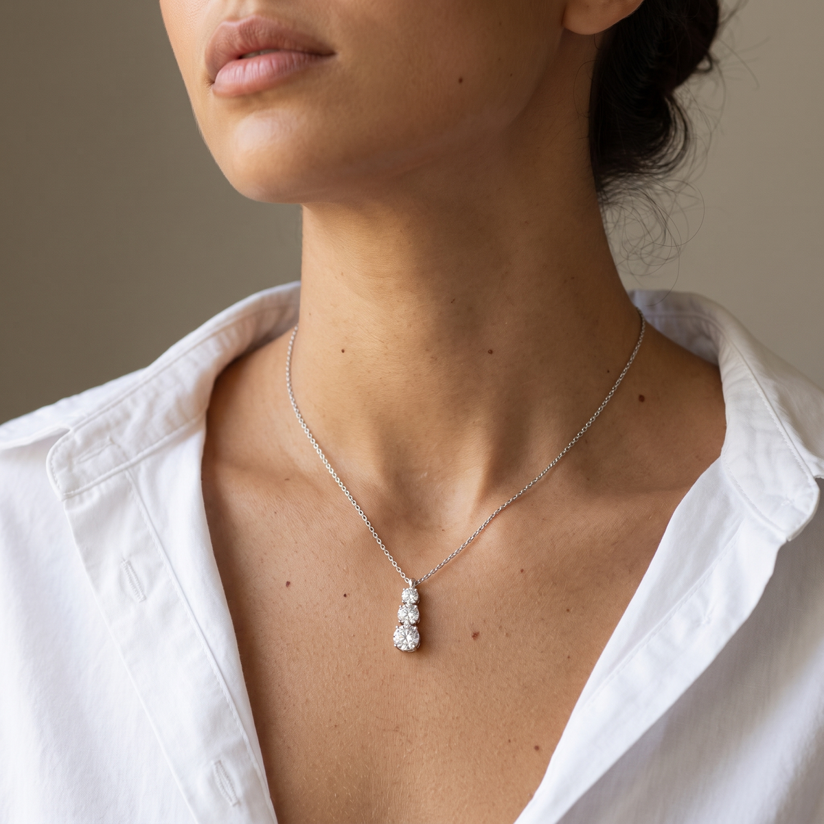 Trio Necklace worn, close-up portrait