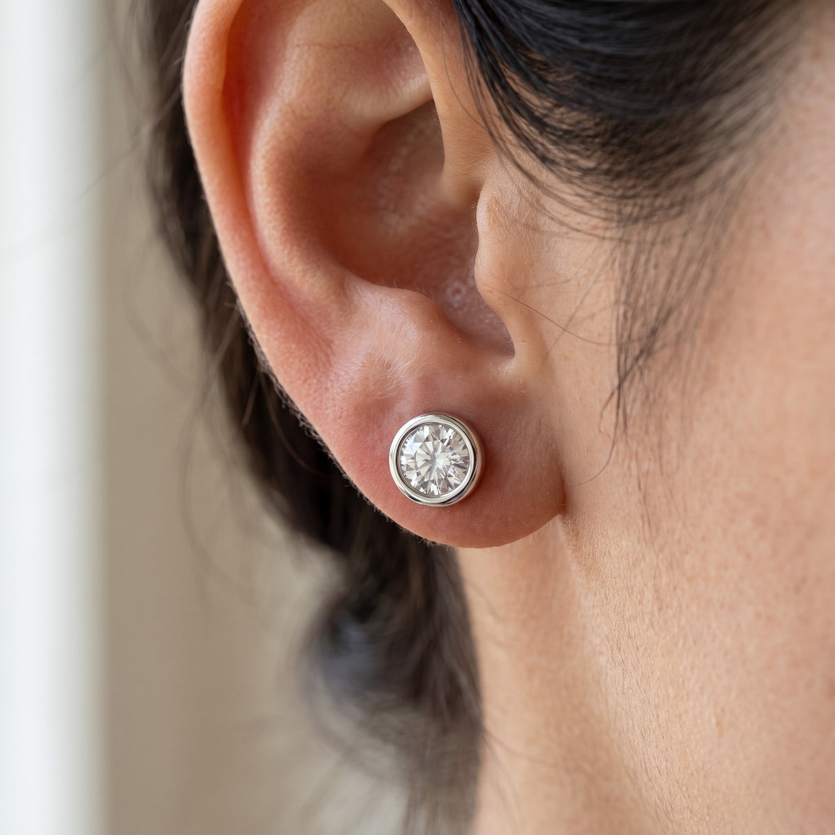 Aura Earrings worn on ear