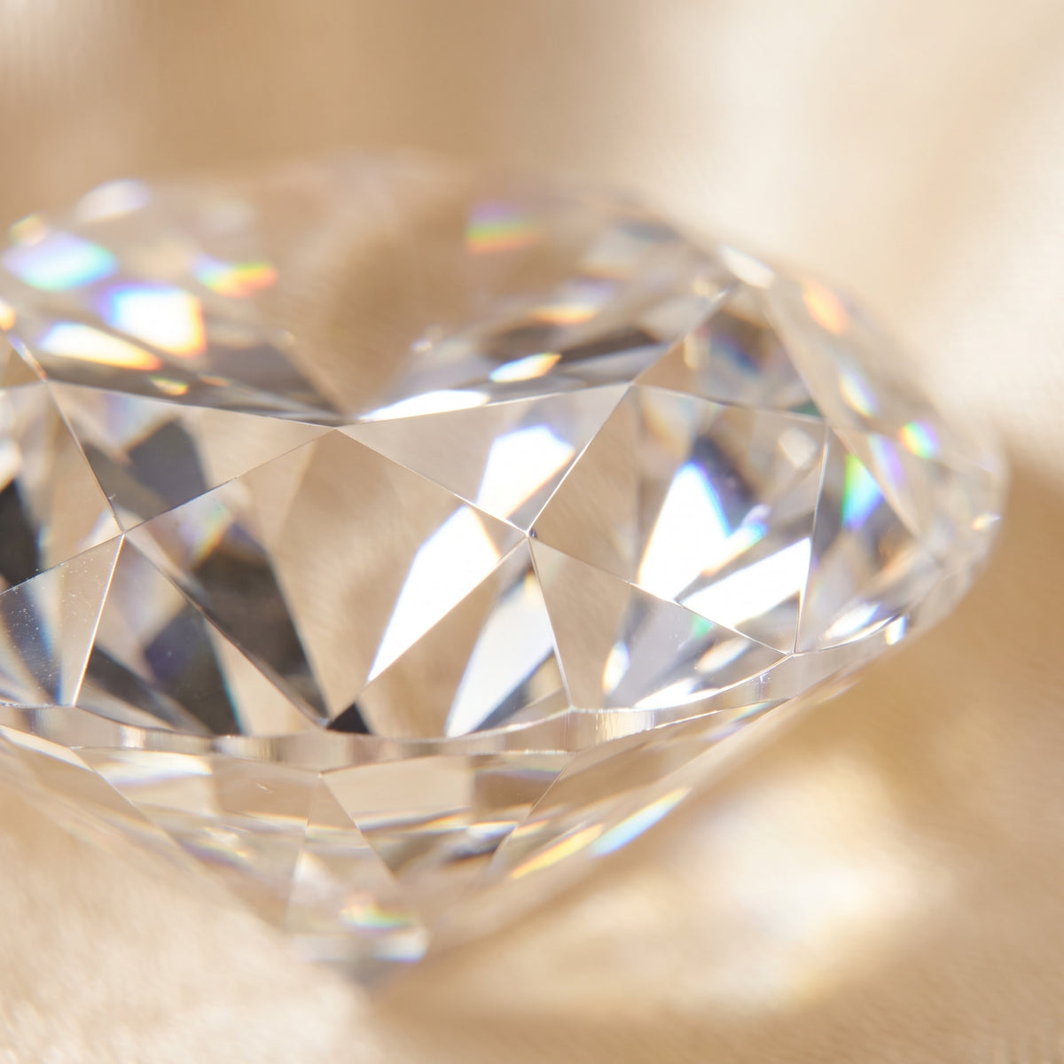 Extreme macro of moissanite crown facets showing rainbow dispersion