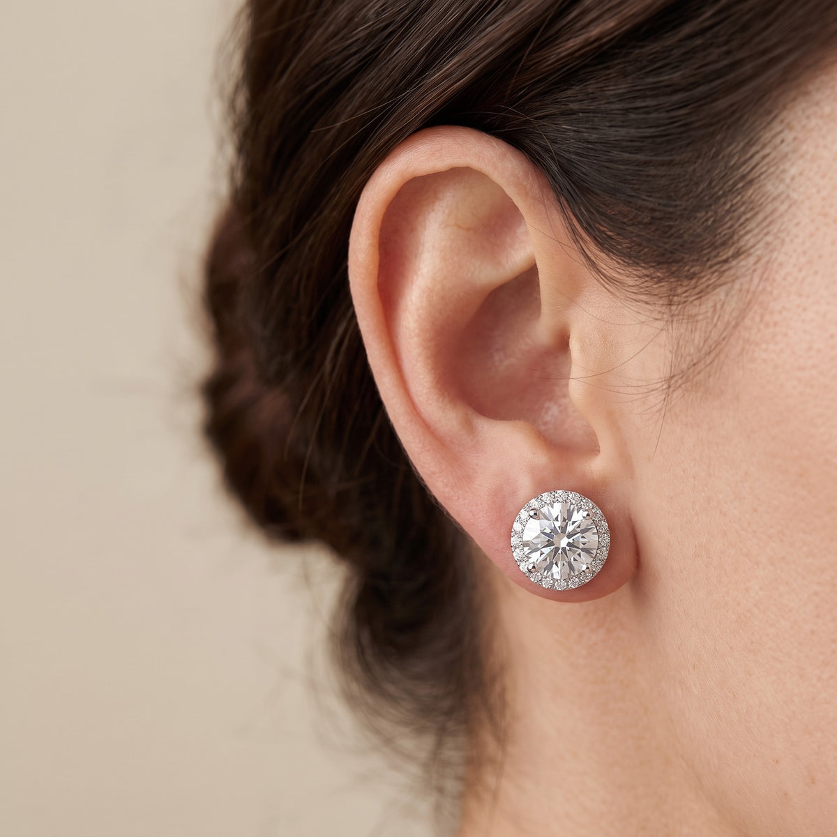 Sole Halo Stud Earrings worn on ear